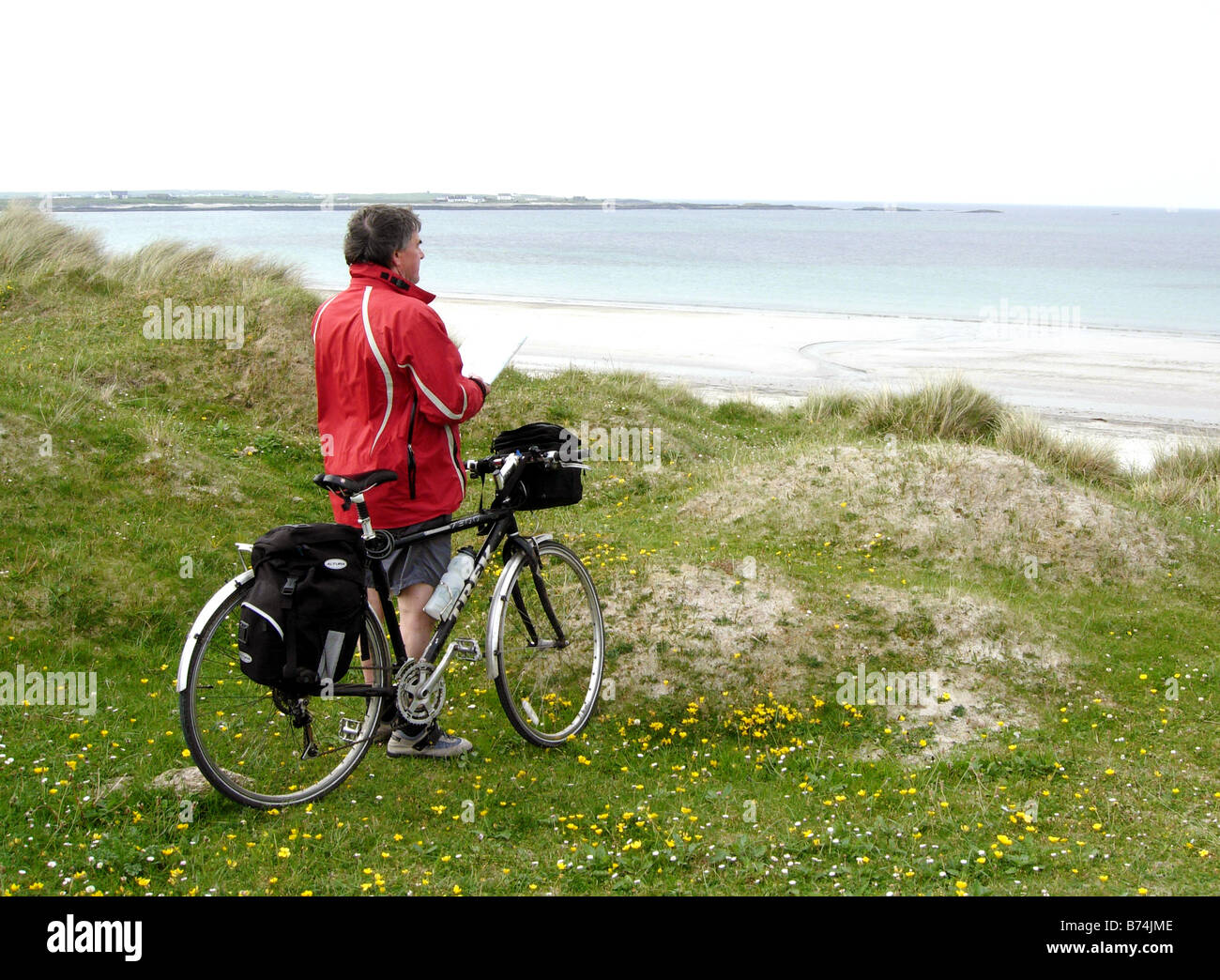 Cyclist on the Inner Hebrides island of Tiree Stock Photo