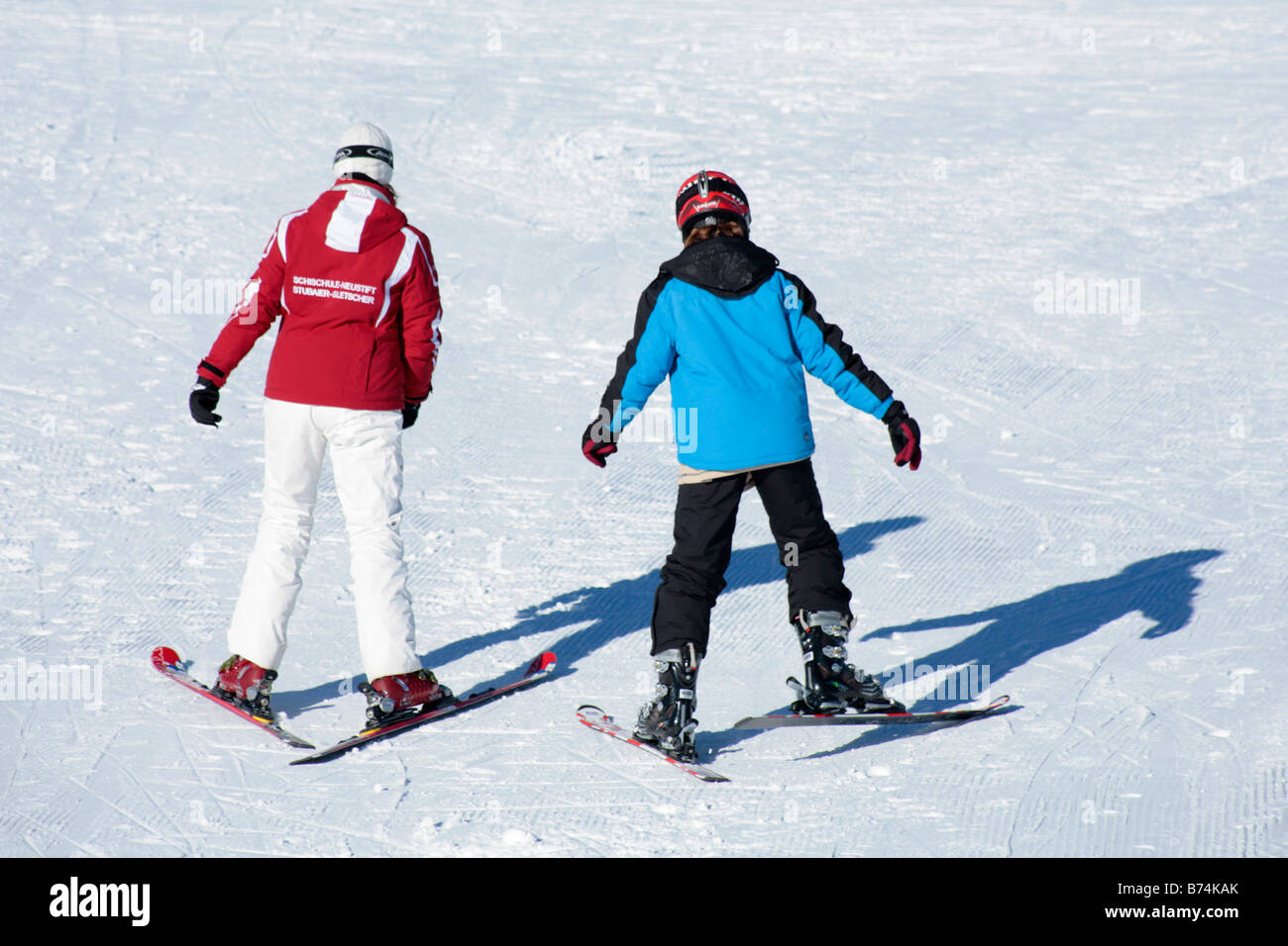 a young boy getting skiing lessons at mountain station Gamsgarten at Stubai Glacier in Tyrol, Austria Stock Photo