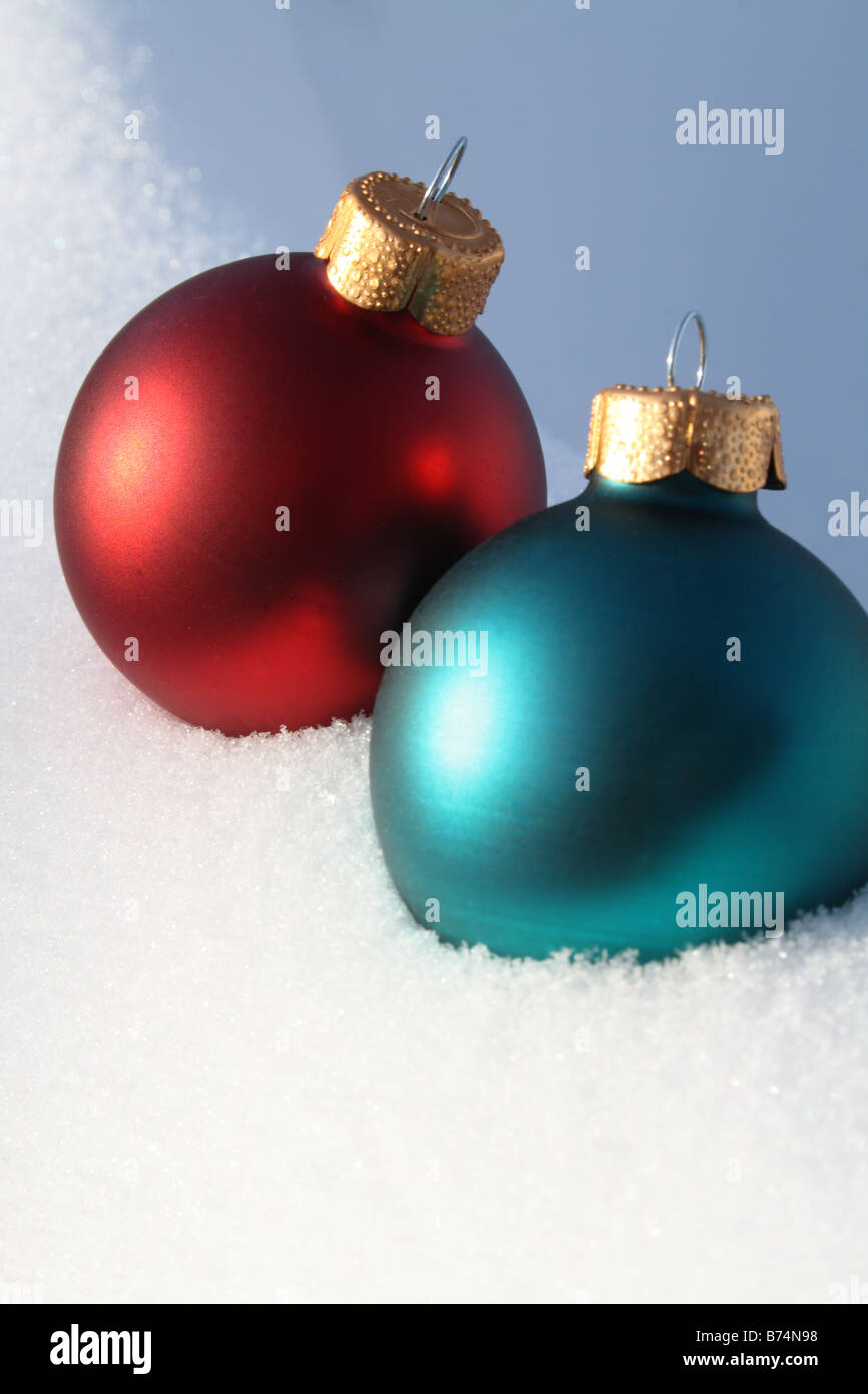 Christmas Tree Decorations in Snow Vertical Stock Photo