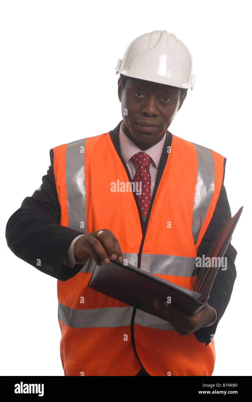 Cut out of a man overseeing building work in a hard hat and hi-viz vest Stock Photo