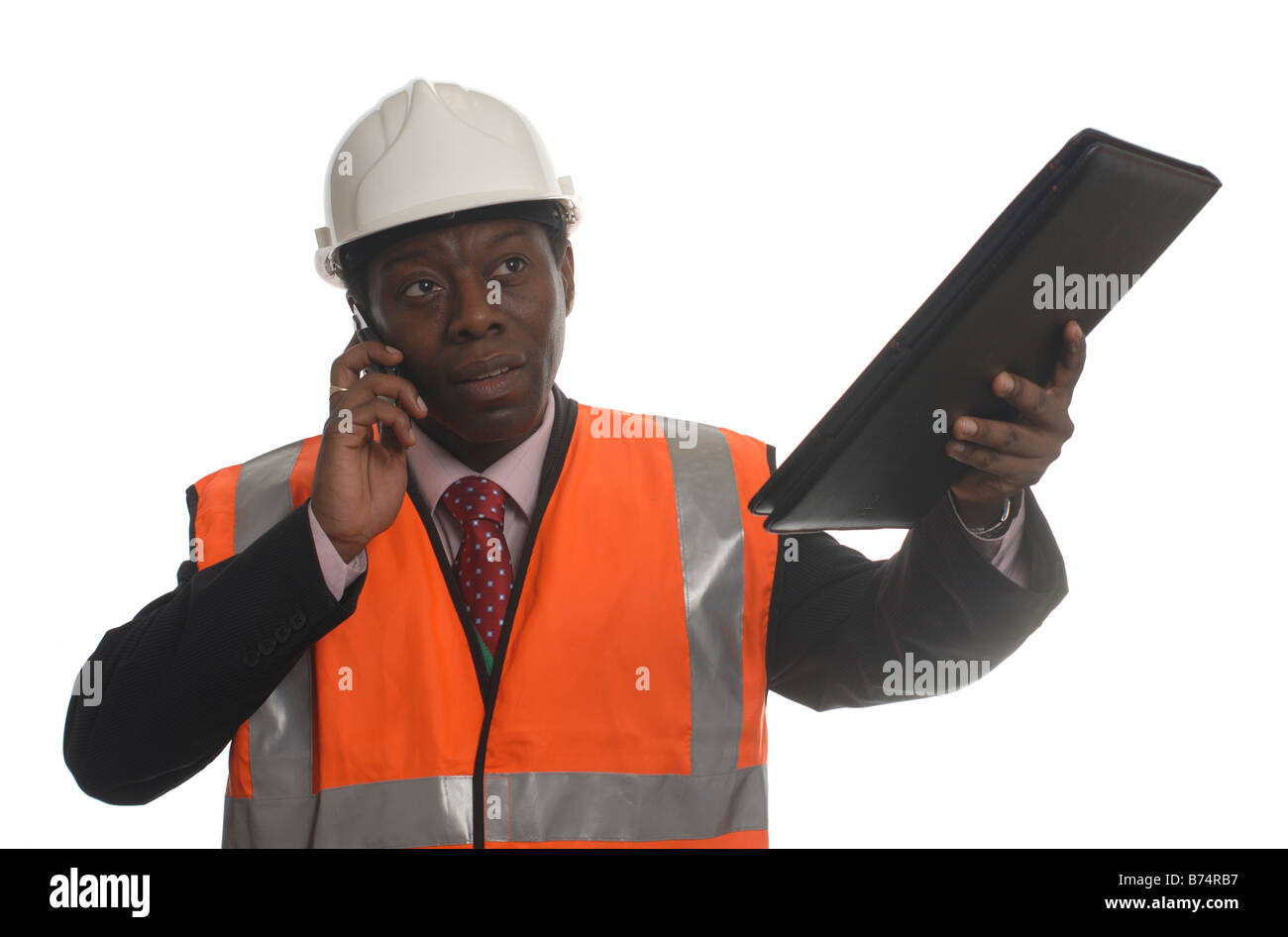 Cut out of a man overseeing building work in a hard hat and hi-viz vest Stock Photo