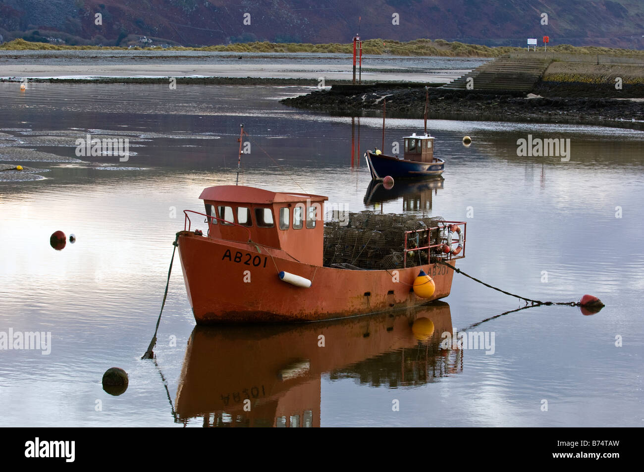 Fishing boats moored up in Barmouth Harbour Gwynedd North Wales Stock Photo