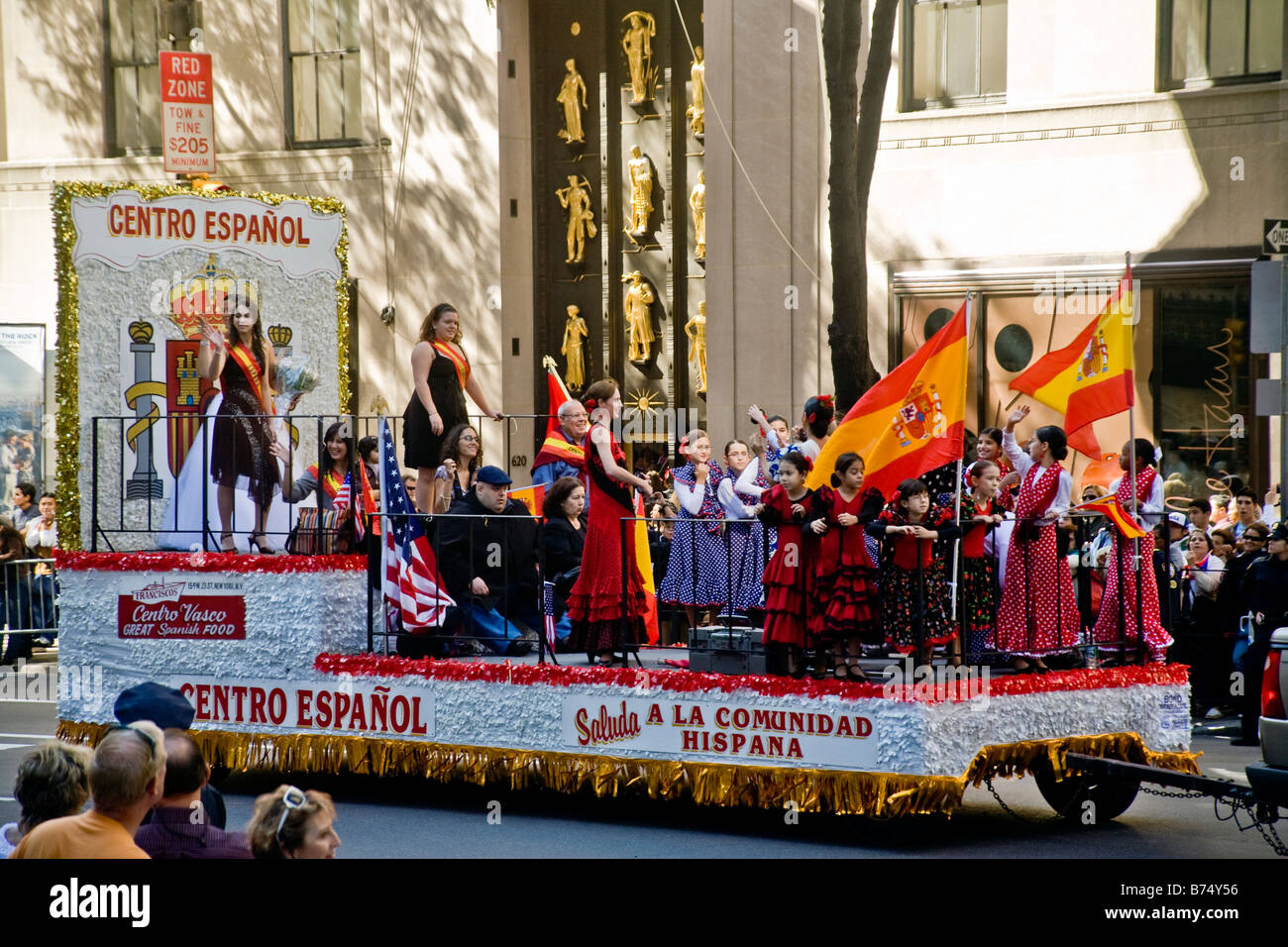 Group of people in a Columbus day parade representing a local hispanic social center Stock Photo
