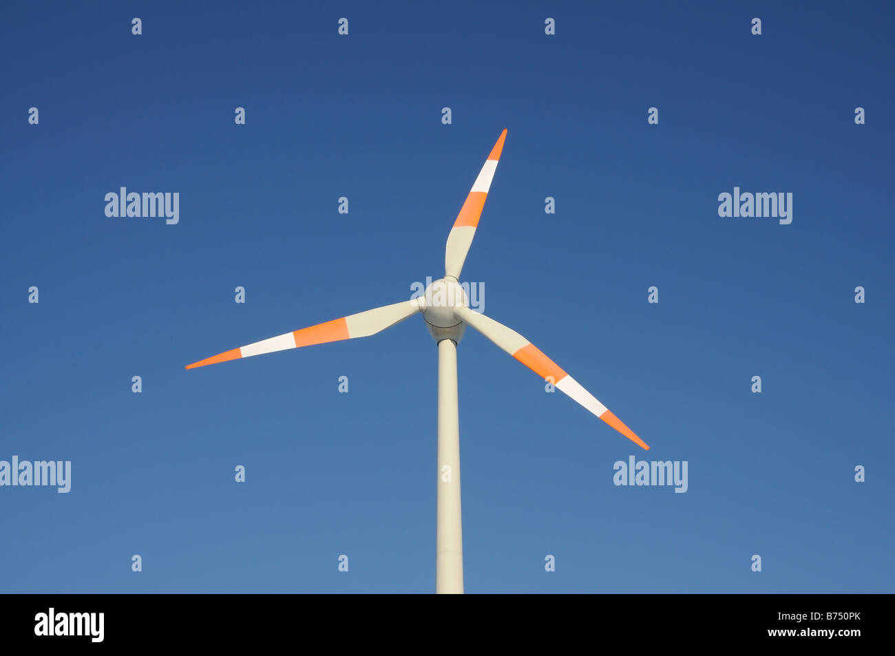 Wind turbine against blue sky Stock Photo - Alamy