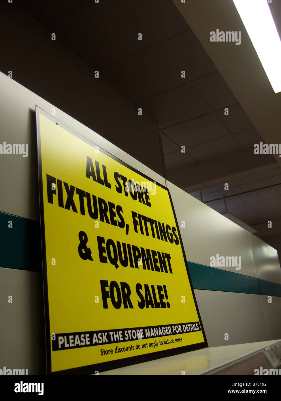 Fixtures & Fittings for sale - signs in a store closing sale due to Liquidation. (Woolworths) Stock Photo