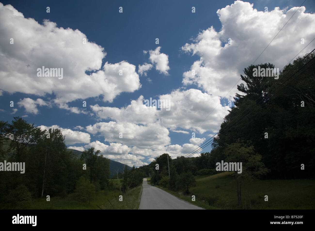 Photograph of a road with mountains, sky and cloud Stock Photo - Alamy