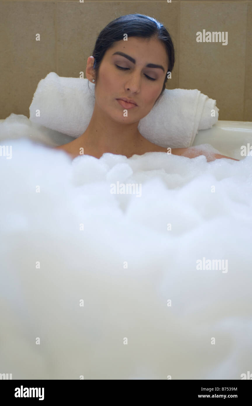 Young woman in a bubble bath Stock Photo - Alamy