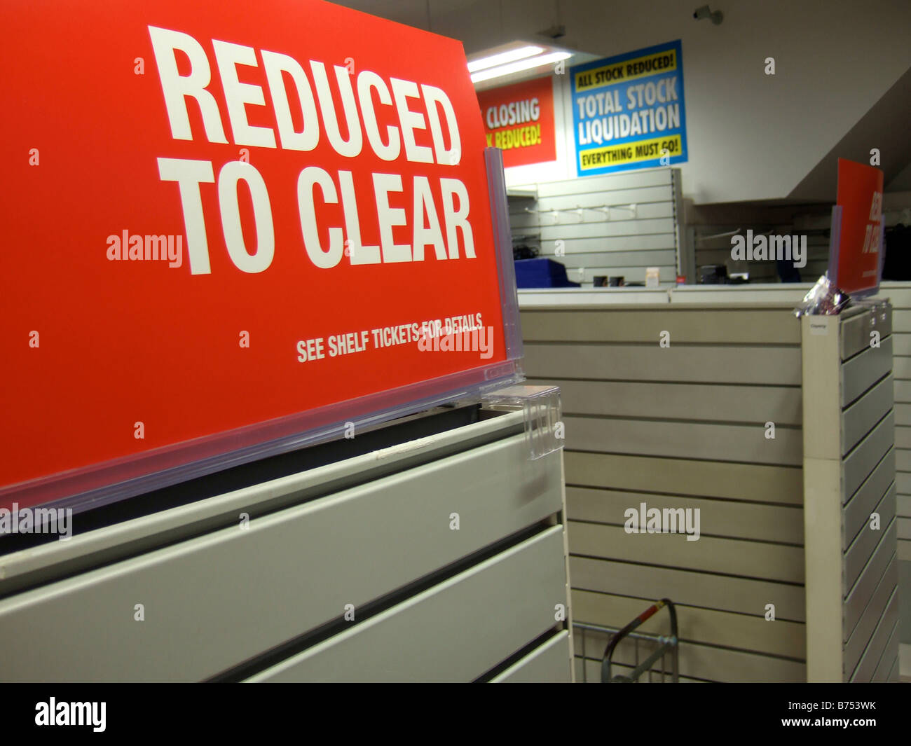 Reduced to Clear - signs in a store closing sale due to Liquidation. (Woolworths) Stock Photo