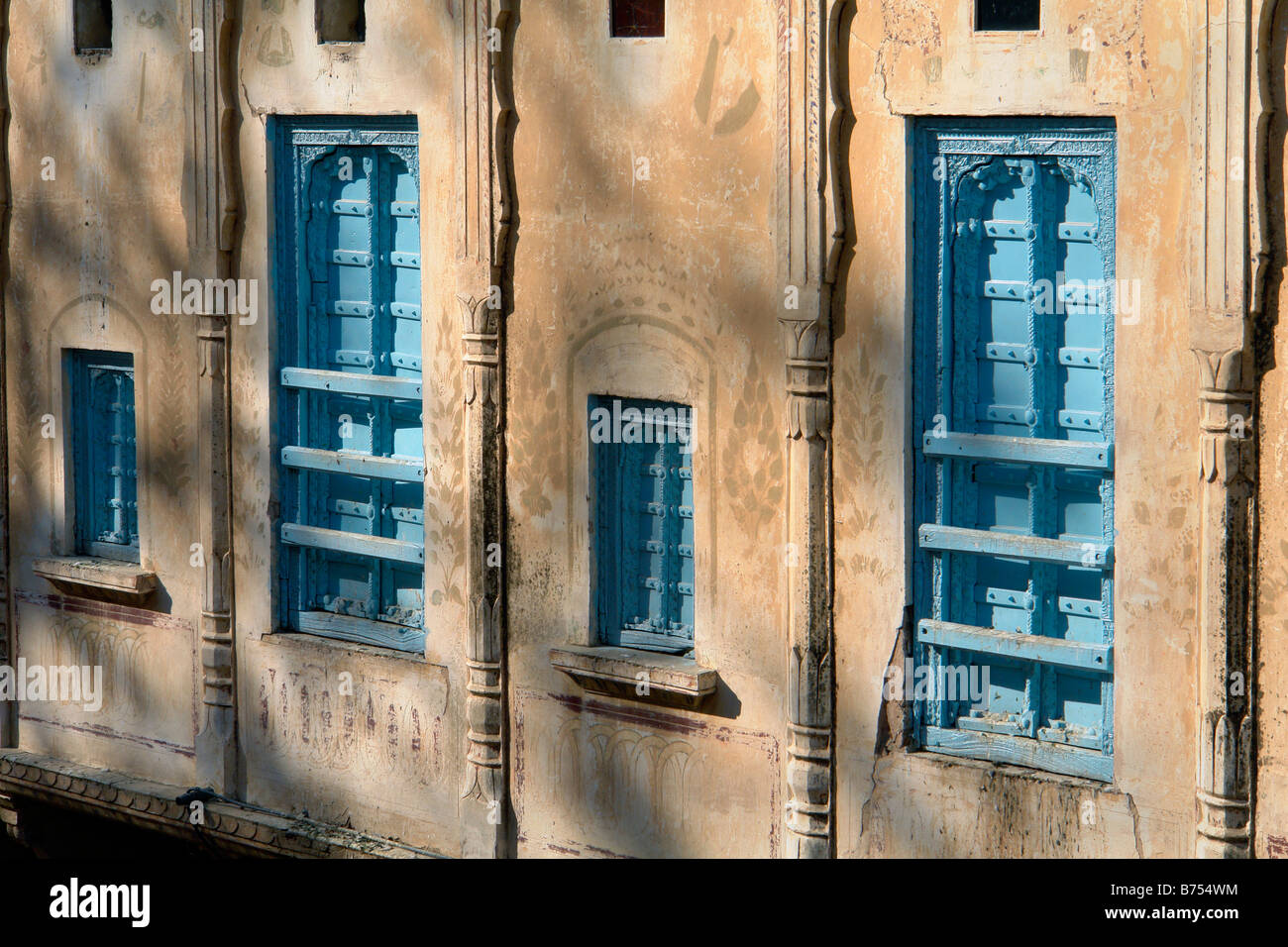 external view of wall and traditional wooden window shutters of a ...