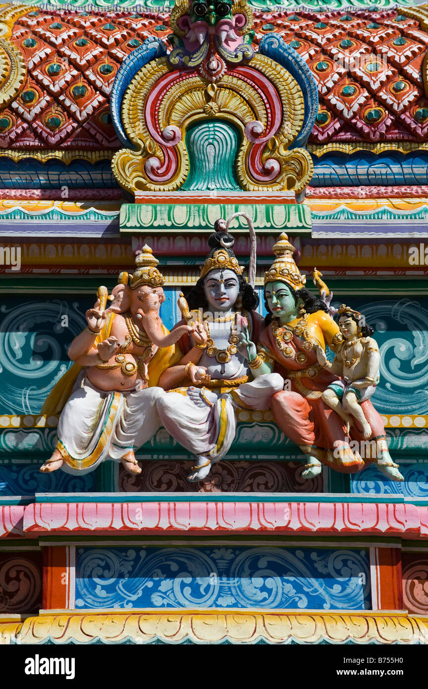 Hindu temple gopuram with Shiva ganesha and parvati statues. South India Stock Photo