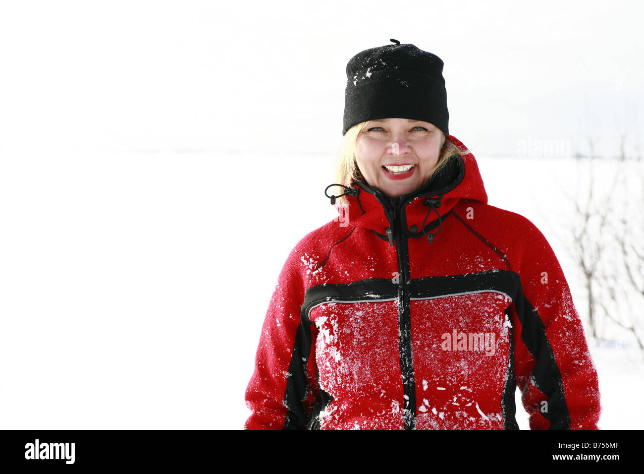 Blonde woman, winter scene, smiling, Ile D'Orleans, Quebec Stock Photo