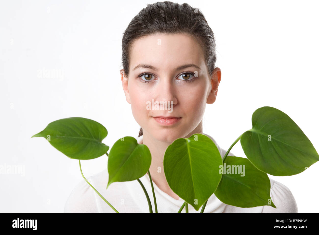 Face of a young woman with leaves, Winnipeg, Manitoba Stock Photo