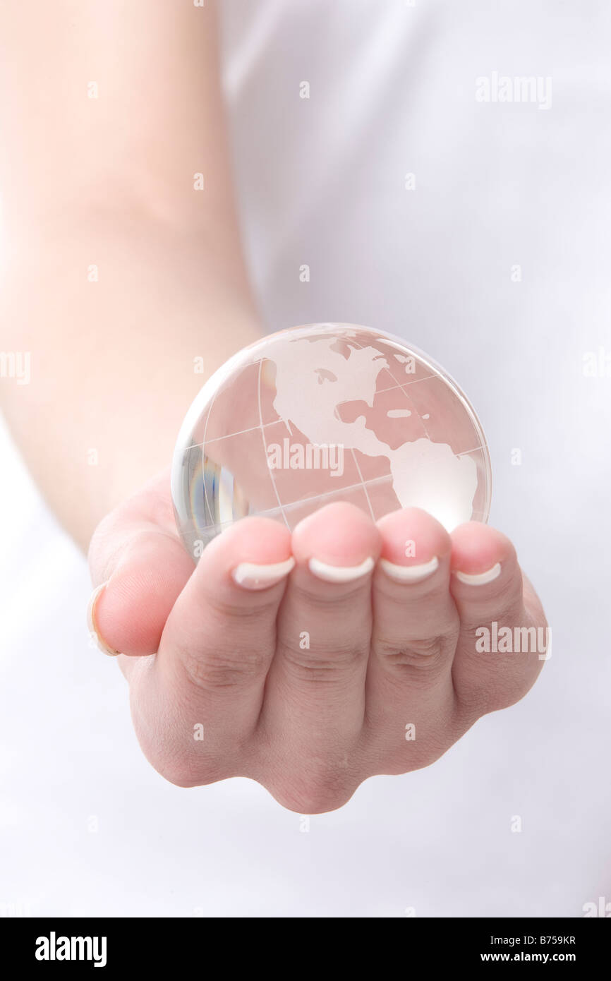 Woman holding globe glass hi-res stock photography and images - Alamy
