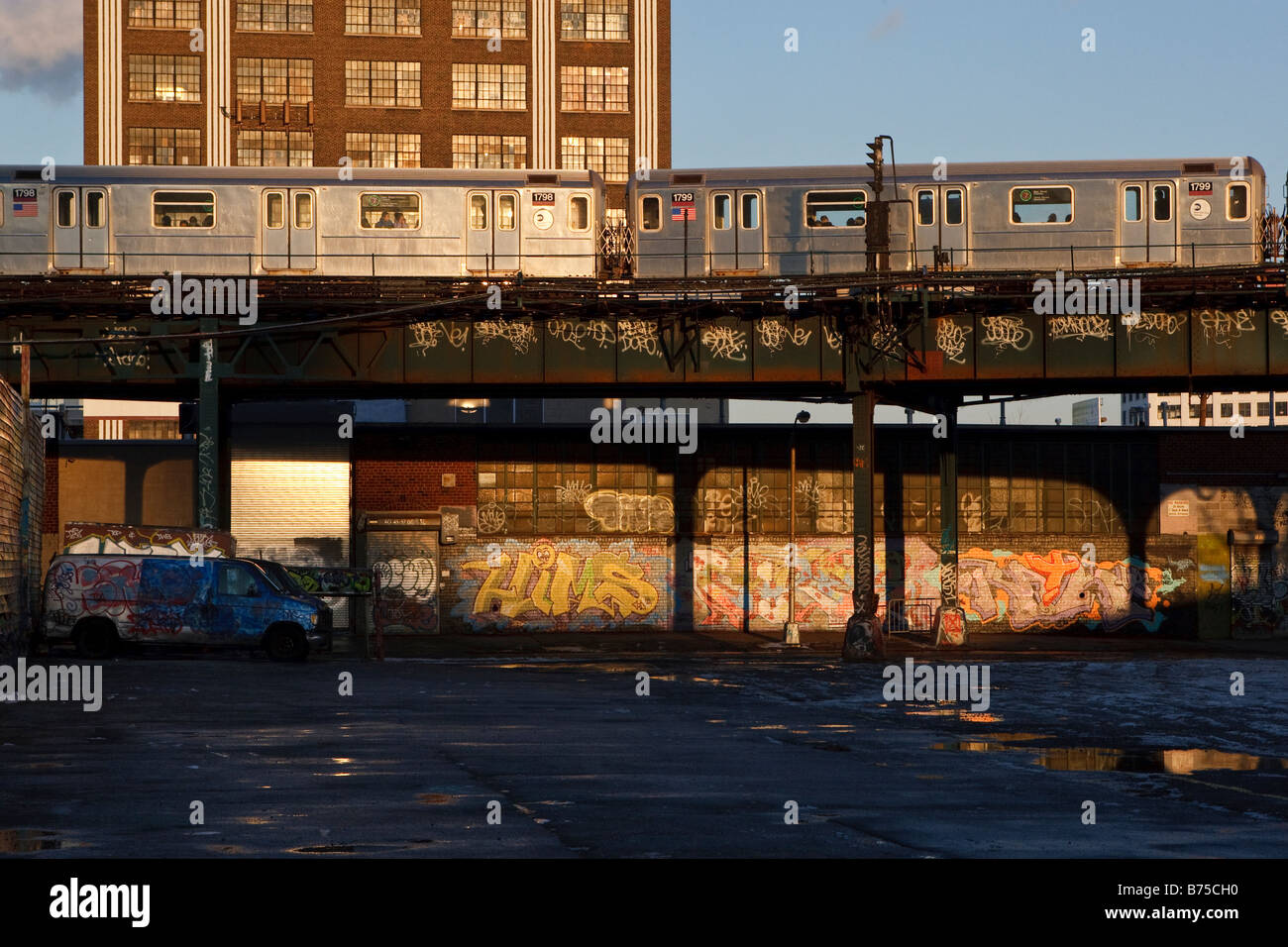 Elevated train travels through ghetto. Stock Photo