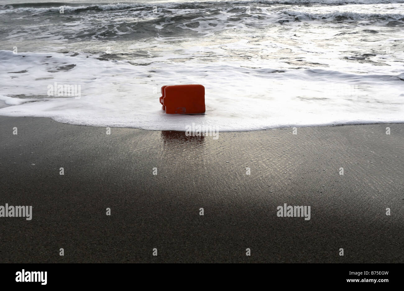 Plastic Container Bottle Washed up on Beach Stock Photo