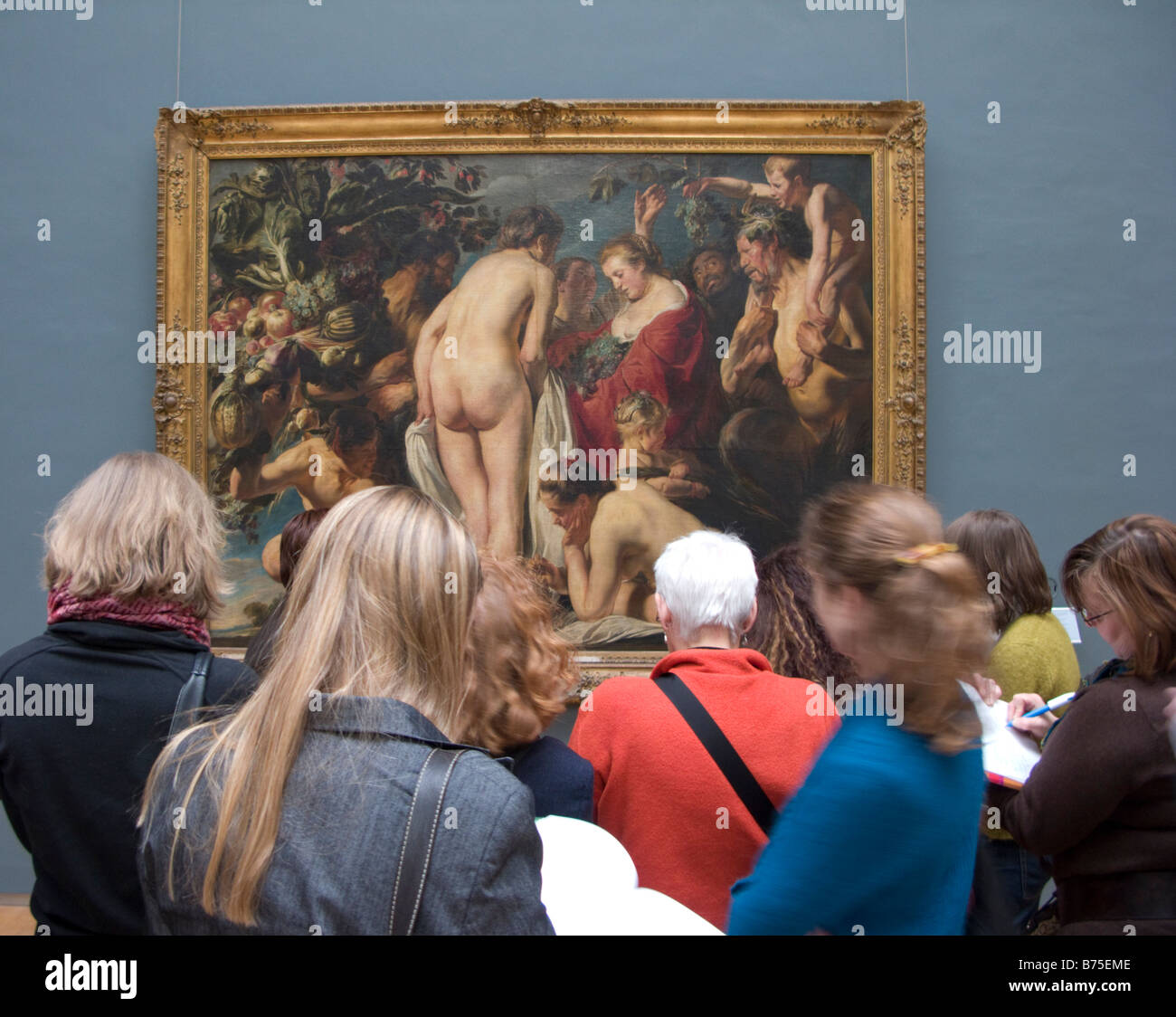 Visitors look at painting inside  Musees royaux des Beaux Arts de Belgique or fine Arts Museum in Brussels Belgium 2009 Stock Photo