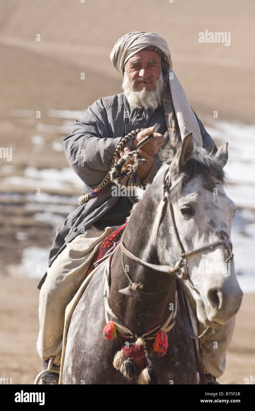 Afghan horsemen take part in the traditional Buzkashi game in Maimana Afghanistan on Tuesday 19th February 2008. Stock Photo