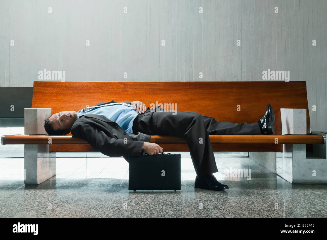 Person sleeping on a bench hi-res stock photography and images - Alamy