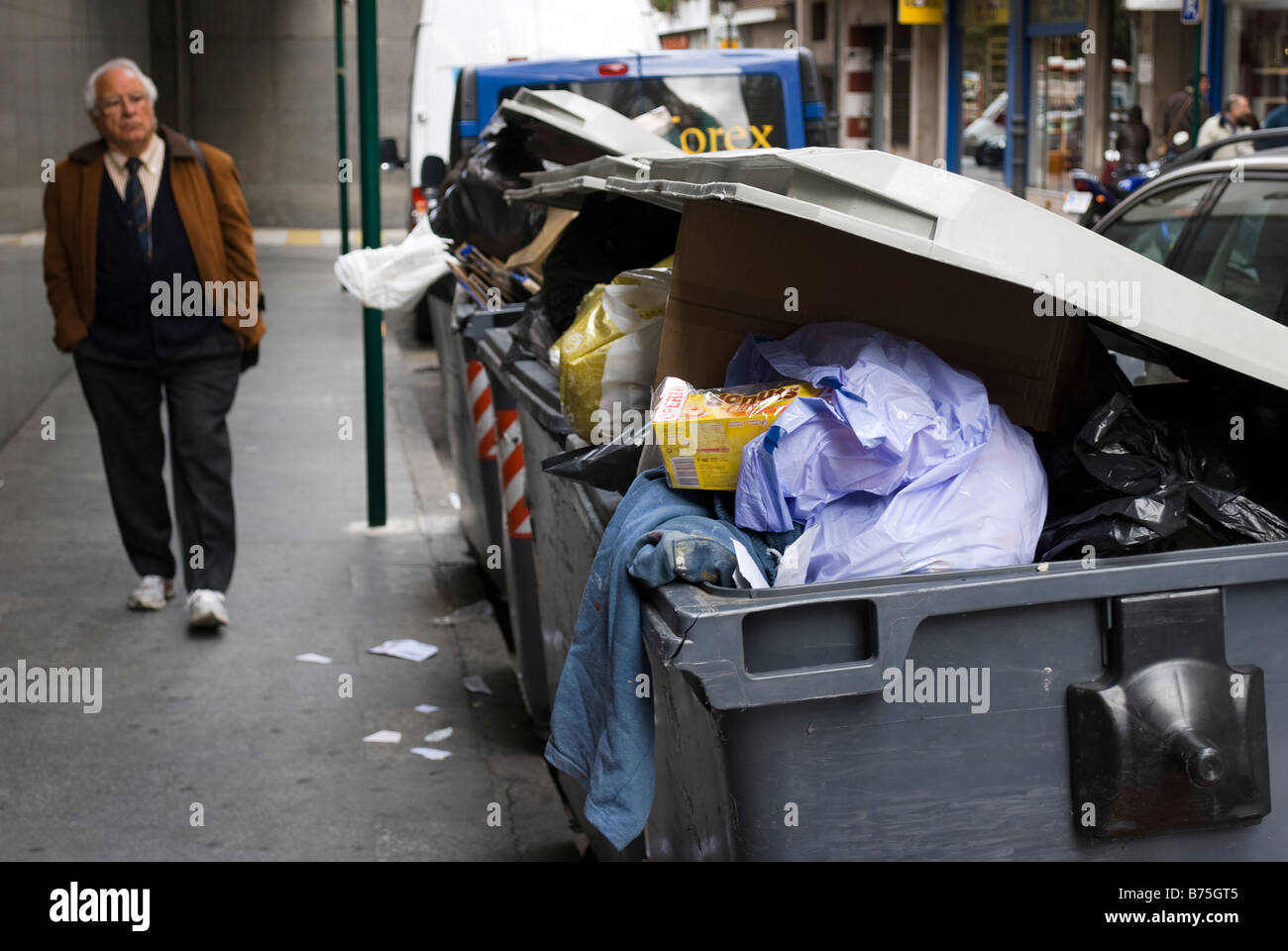 Mixture of unsorted waste in large collection bins in Valencia city Spain Stock Photo