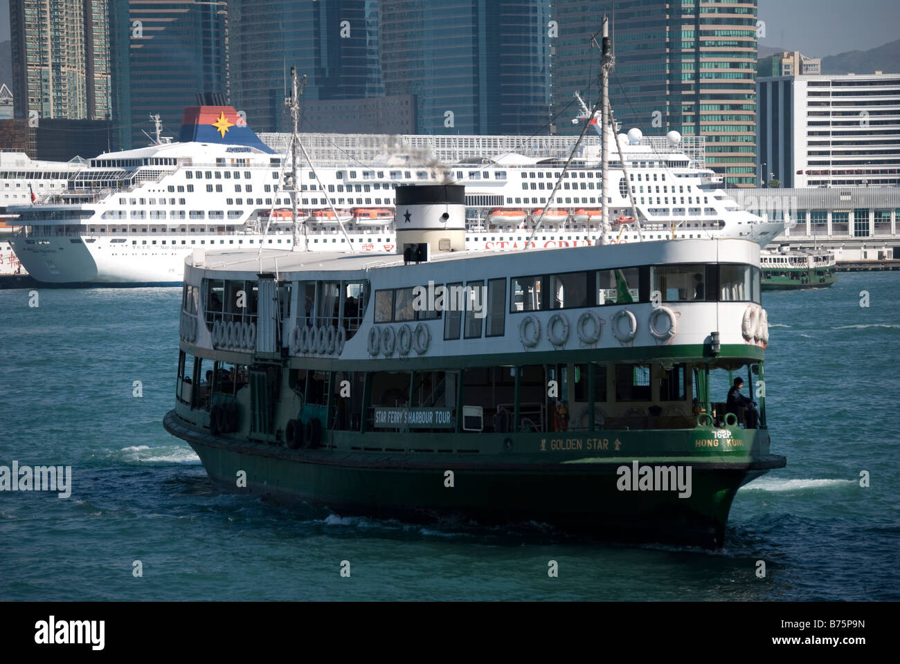 Star Ferry crossing from Tsim Sha Tsui, Central Pier, Sheung Wan, Victoria Harbour, Hong Kong Island, Hong Kong, China Stock Photo