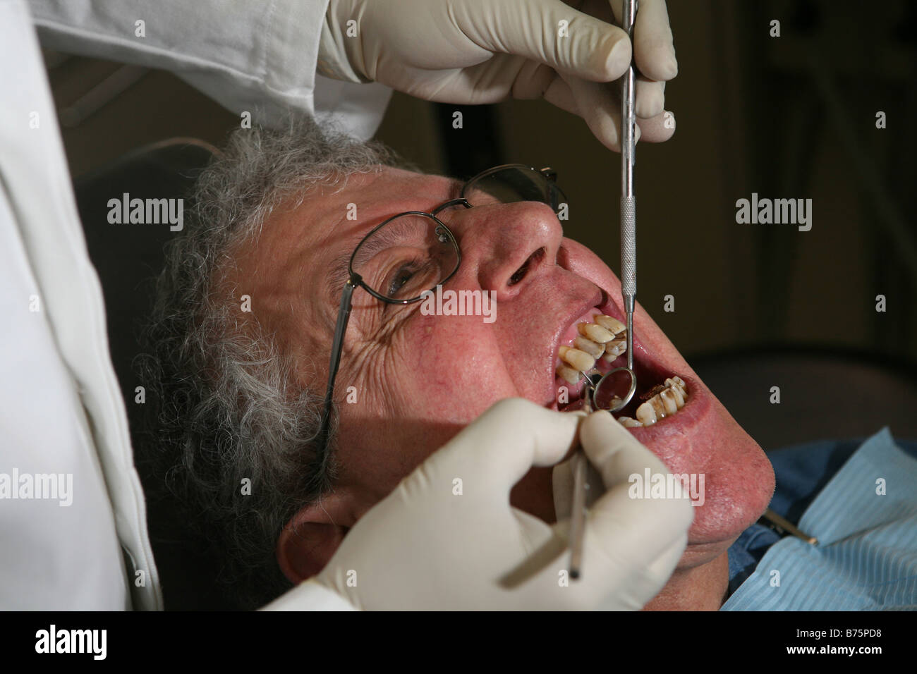 a dentist performing dental surgery on a male patient using hypnosis and not using anesthetic