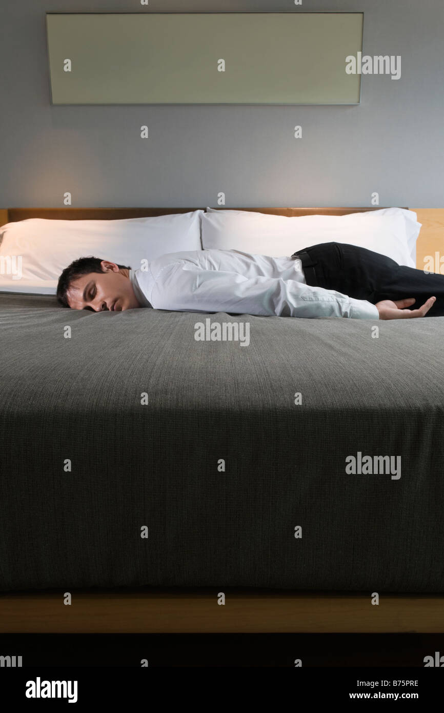 Businessman sleeping on the bed Stock Photo Alamy