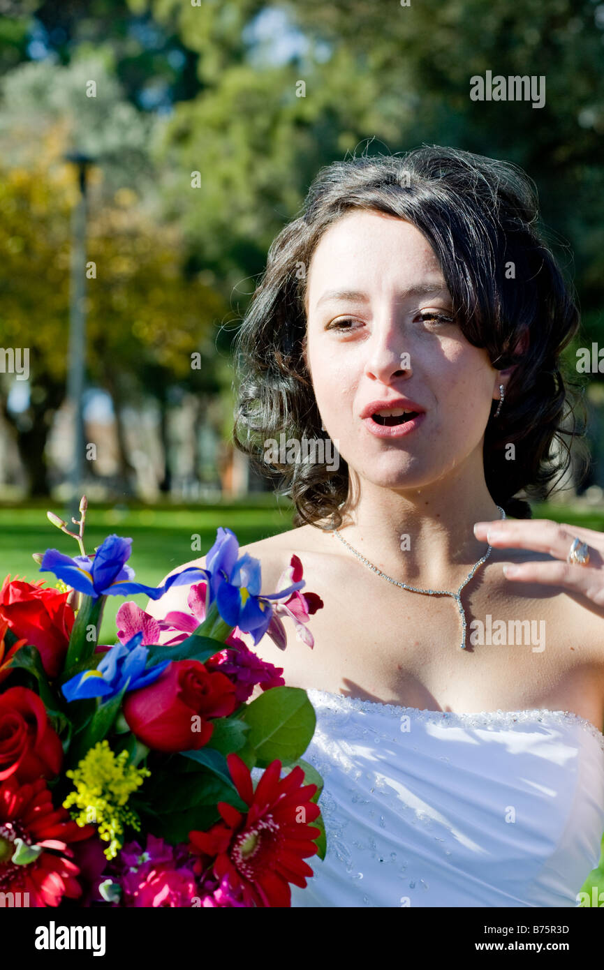 Bride after her wedding holding onto her bouquet of flowers Stock Photo