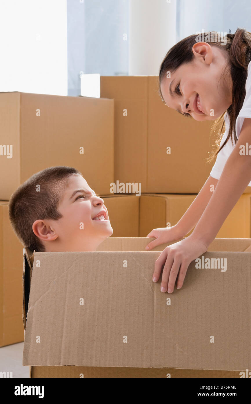 Side profile of a boy and a girl looking at each other and smiling ...
