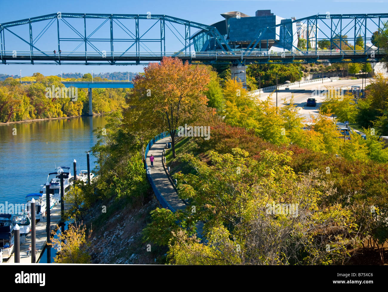 People walking along the Riverwalk beside the Tennessee River in Chattanooga Tennessee Stock Photo
