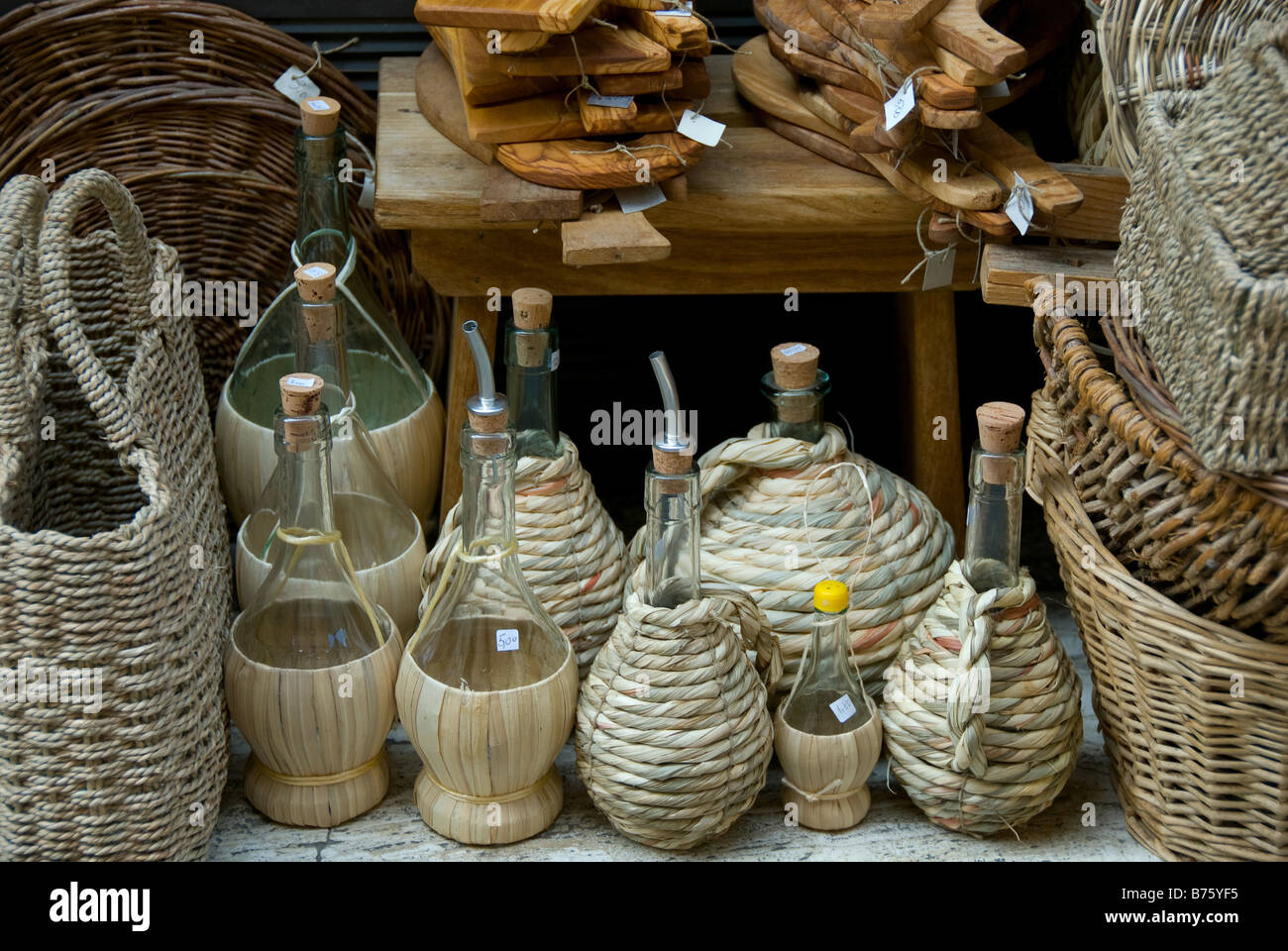 Authentic artisan glass wine bottles and wicker baskets made by hand on