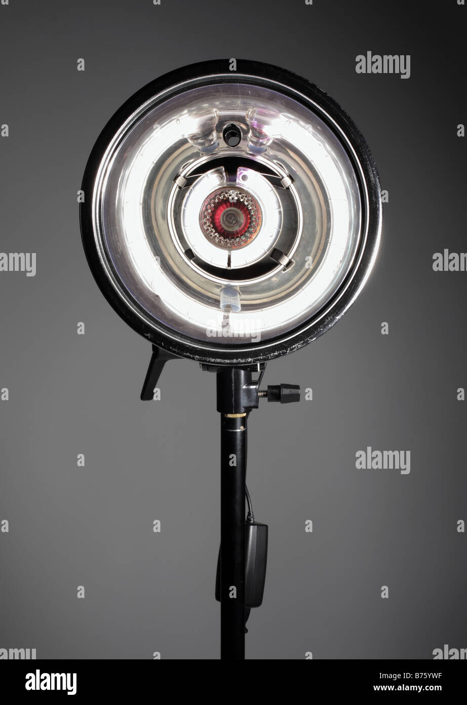 photo of studio light on stand firing at camera Stock Photo