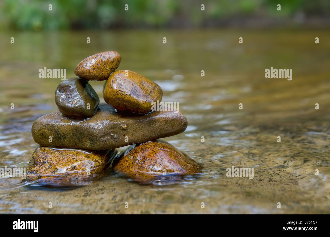 great image of tower of balancing rocks or stones in the river Stock Photo