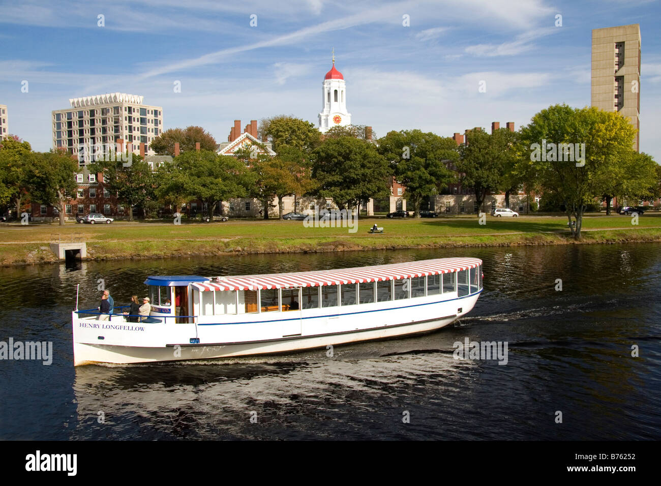 Tour boat on the Charles River and Harvard University in Cambridge Greater Boston Massachusetts USA Stock Photo