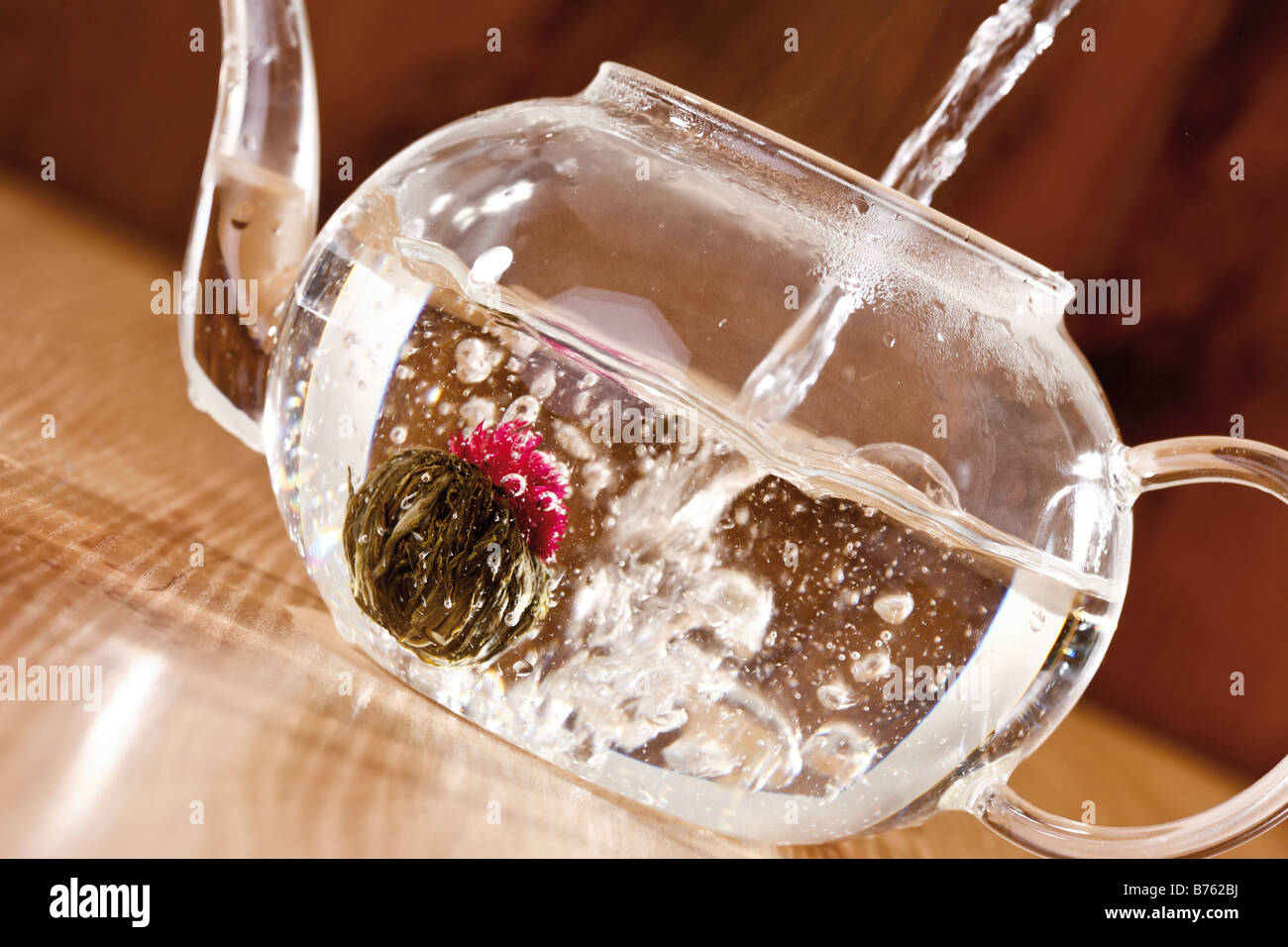 Pouring hot water into Teapot, closeup Stock Photo Alamy