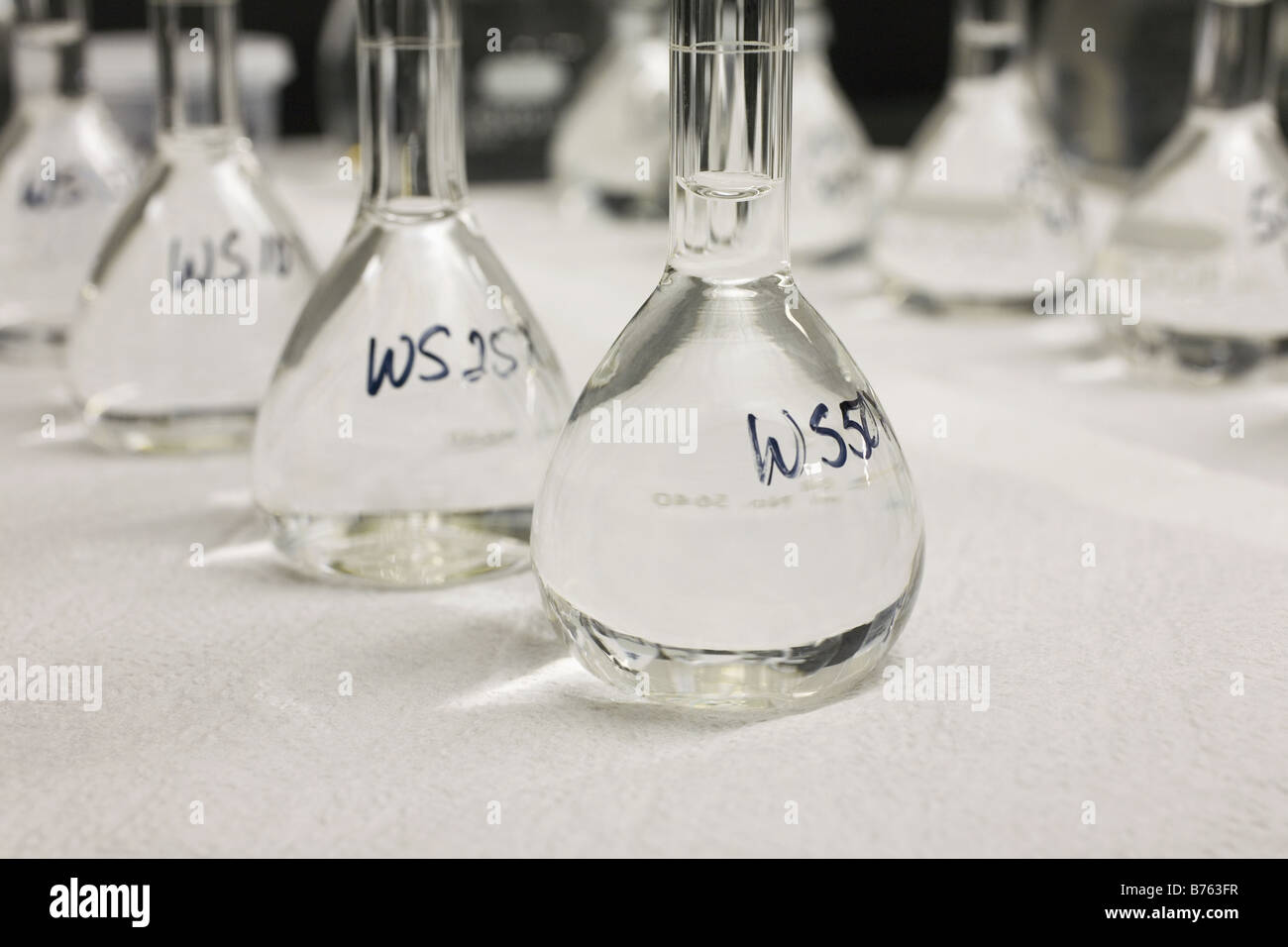 Close-up of volumetric flasks in a row Stock Photo