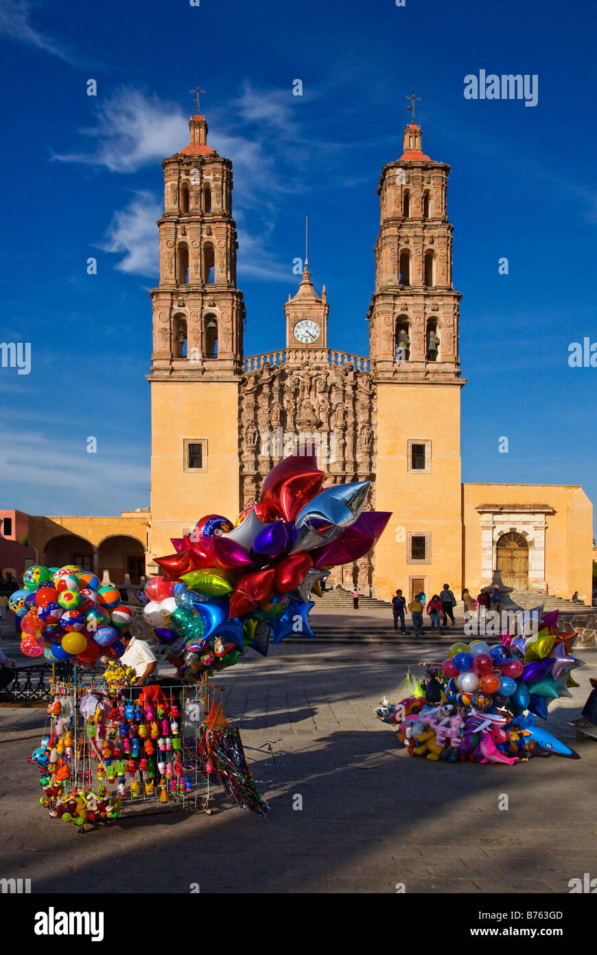 BALOONS are sold in front of the DOLORES HIDALGO CATHEDRAL built in the 16th century GUANAJUATO MEXICO Stock Photo