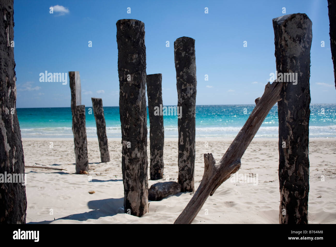 Posts from an old pier in Mexico Stock Photo