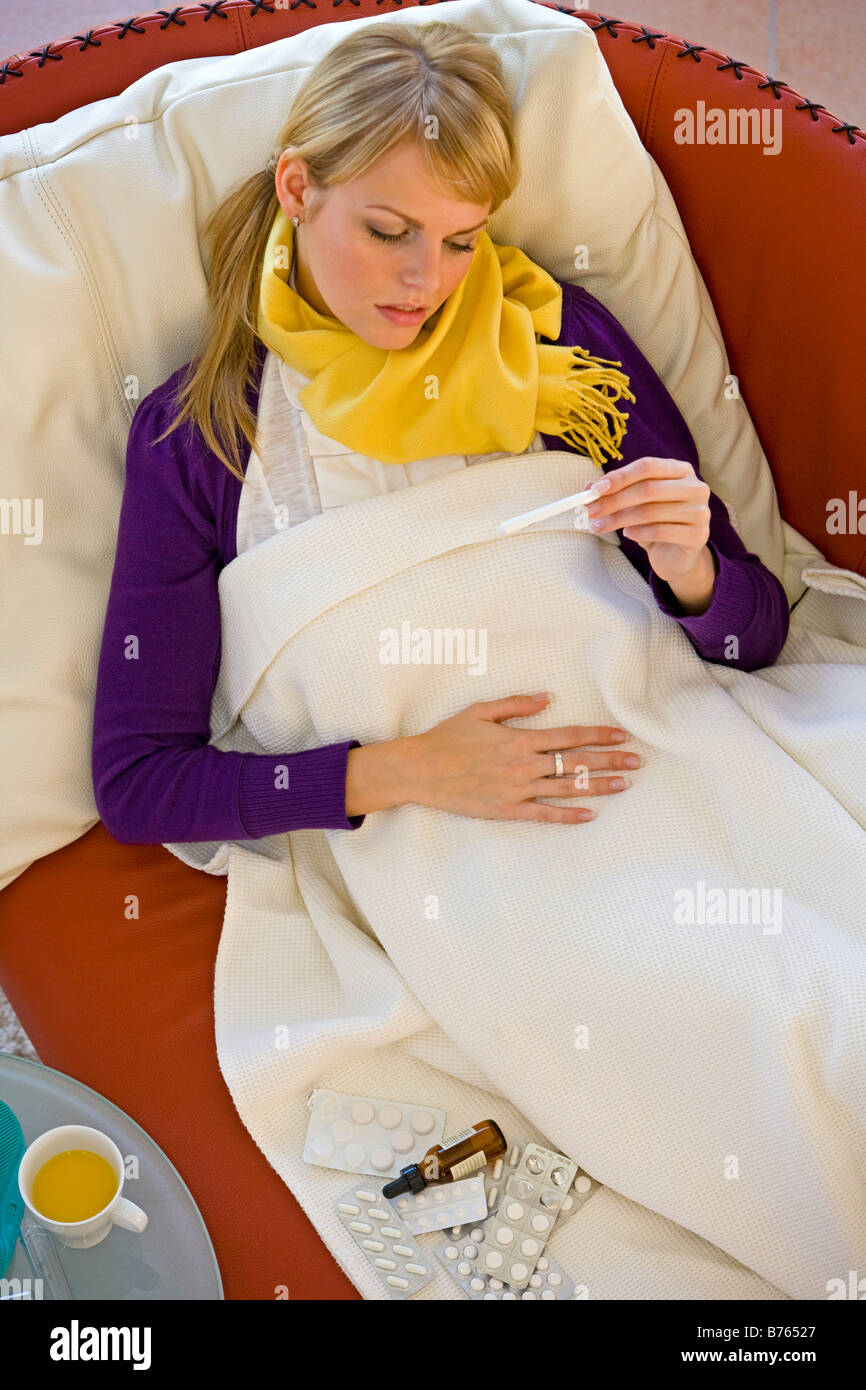 Frau mit einer Erkaeltung, woman having a cold Stock Photo