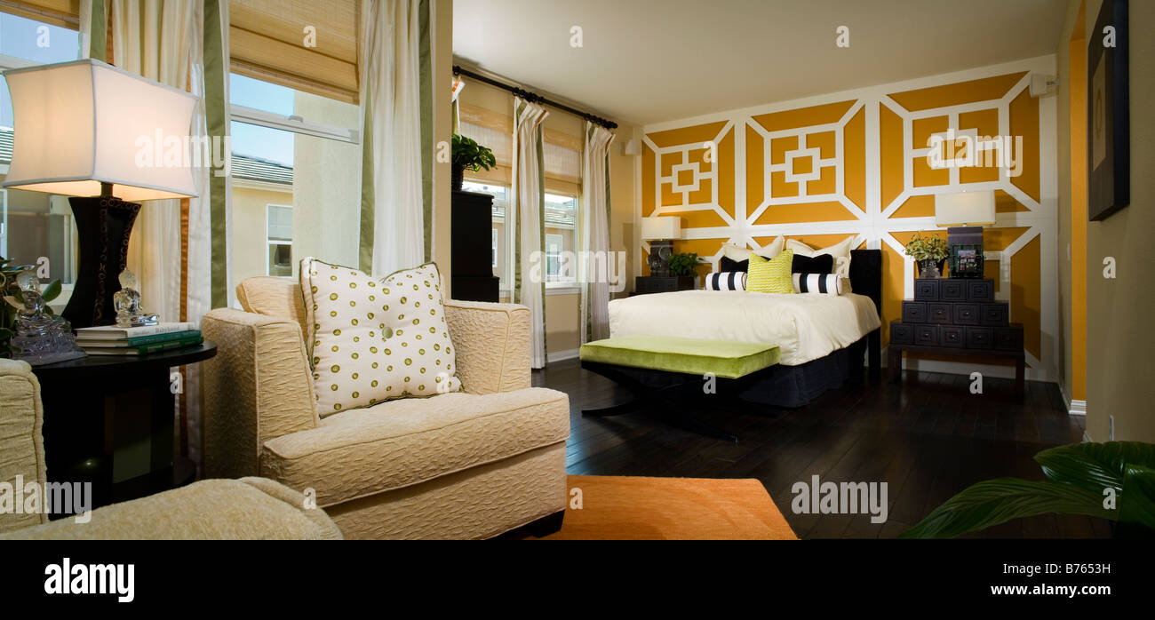 Large Contemporary Master Bedroom with Orange Accents Stock Photo - Alamy