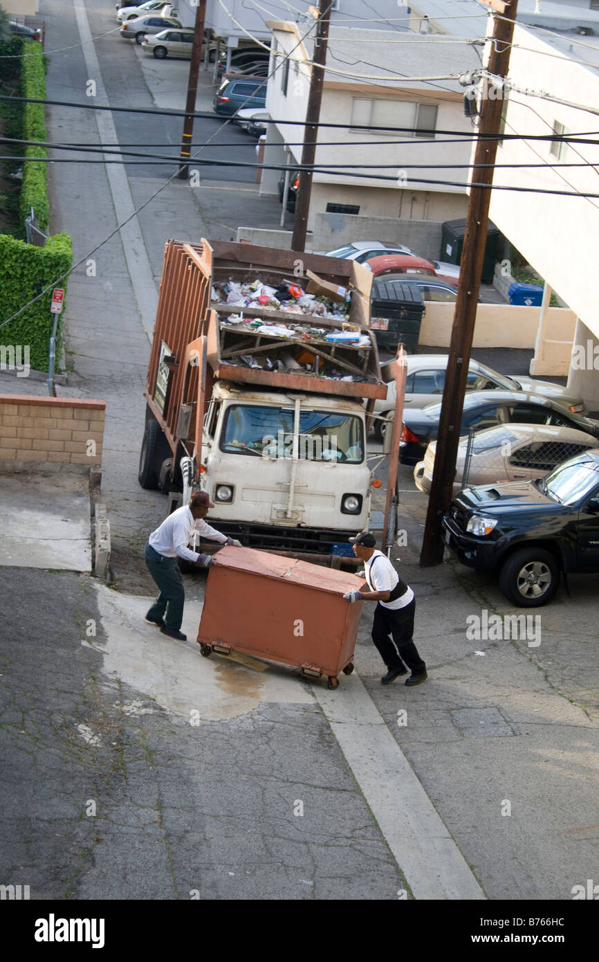 Garbage Truck picks up dumpsters of nonrecyclable trash in West LA