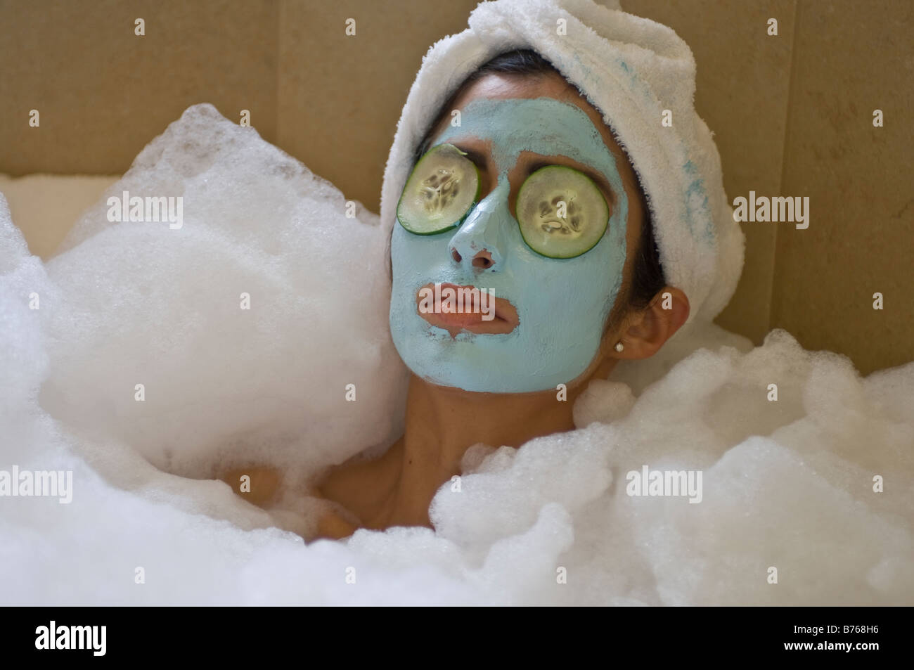 Download Young Woman In A Bubble Bath W Face Mask Cucumbers On Eyes Stock Photo Alamy Yellowimages Mockups