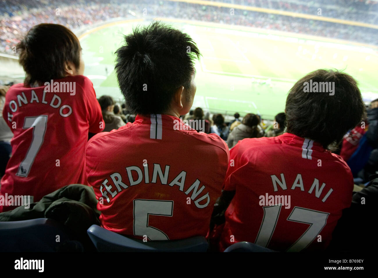 Japanese Manchester United football fans wearing strips bearing names of their idols/ players. Stock Photo