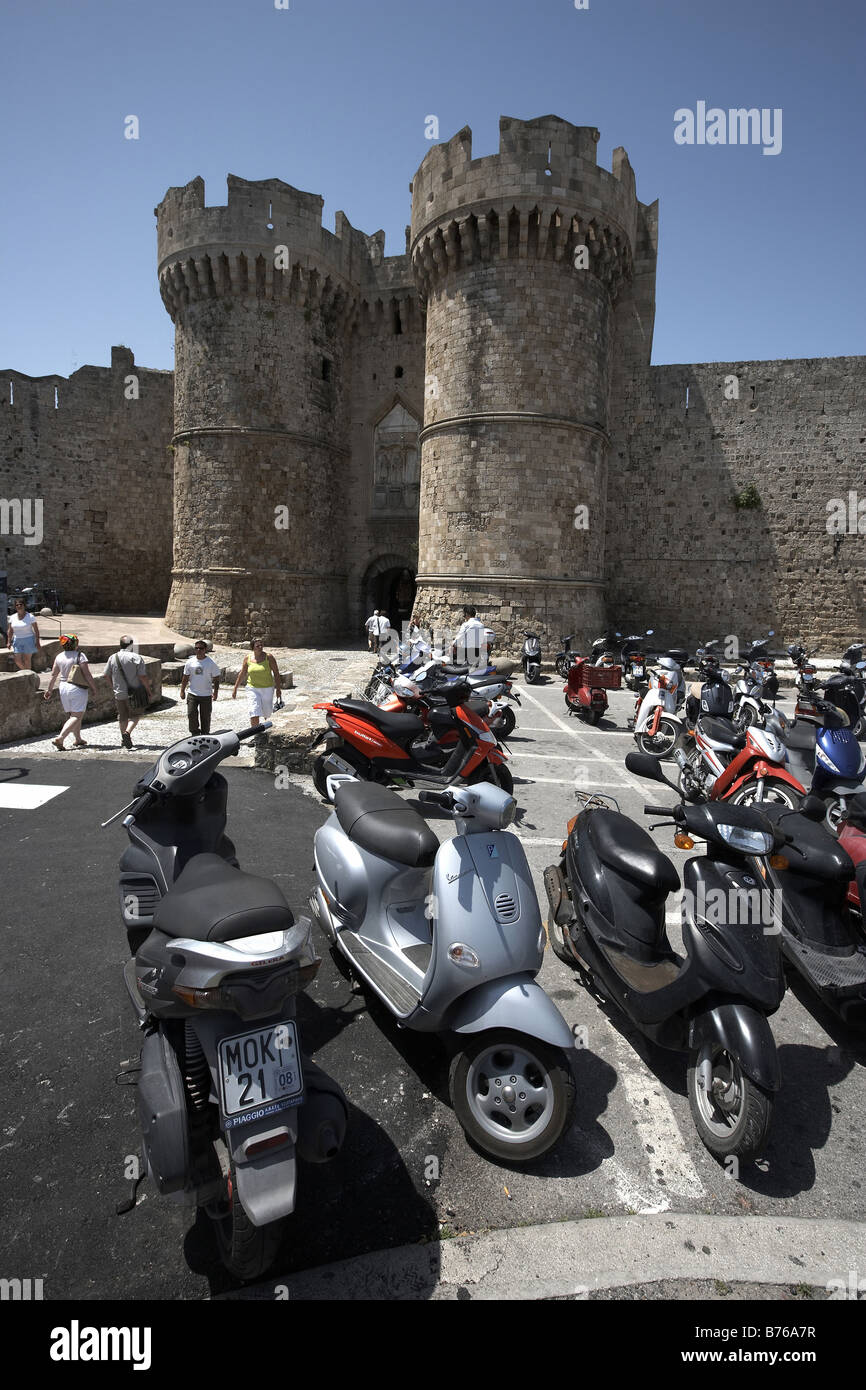 Scooters parked outside the Medieval town gate Rodos Island of Rhodes Greece Stock Photo
