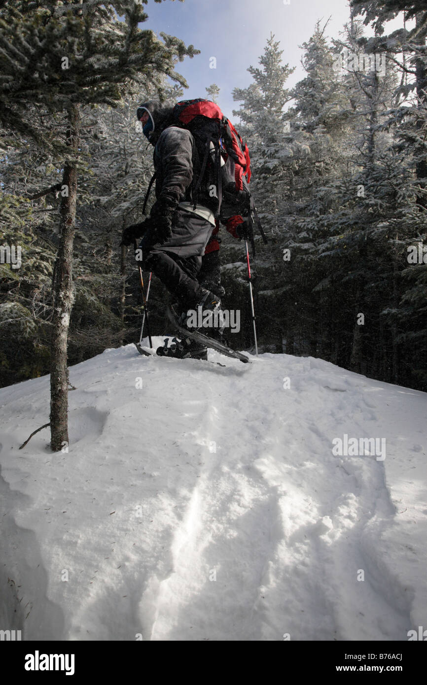 Hiker on snowshoeing on Mount Tecumseh Trail during the winter months ...