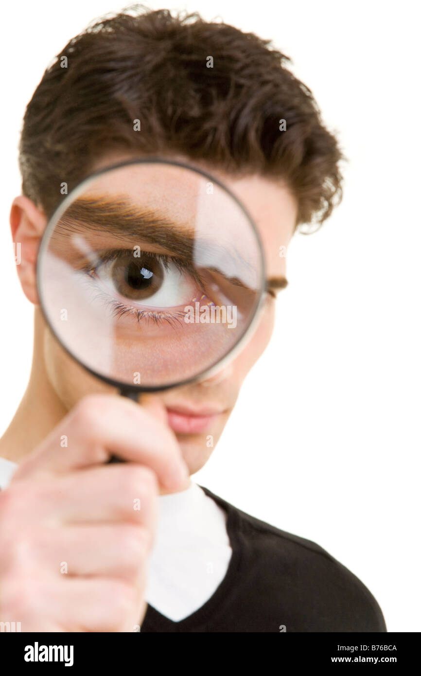 young man with loupe Stock Photo