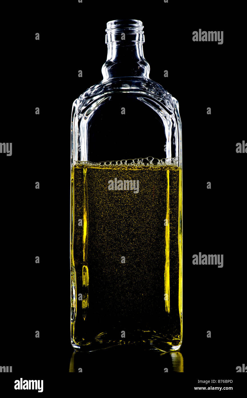 object on black Colored Bottle with liquid Stock Photo