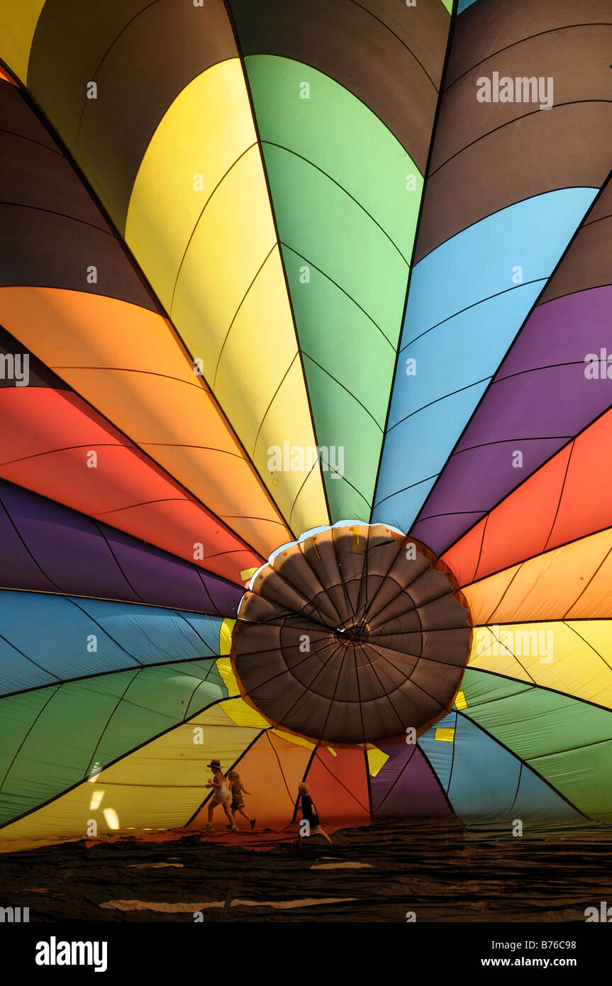 Children and adults inside a hot air balloon at the Dansville Balloon