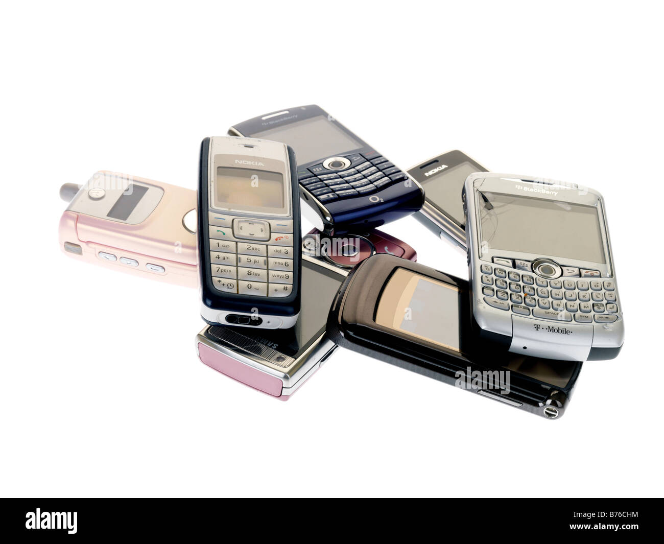 Collection or Pile of Old Yesterdays Technology Mobile Cell Phones Out Of Date No longer Used Or Wanted As Communication Technology Advances Stock Photo