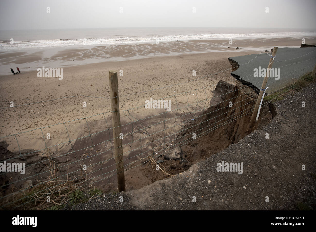 Coastal Erosion Cliffs houses and road collapsing into the north sea at Ulrome and Skipsea East Yorkshire UK Stock Photo