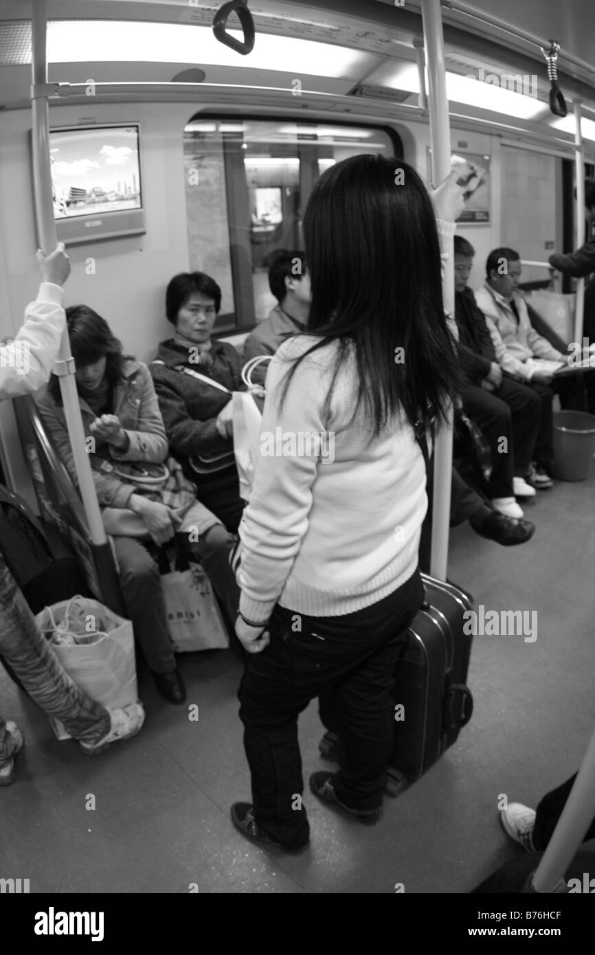 Chinese Woman Traviling on Subway durring Chinese New Year Stock Photo